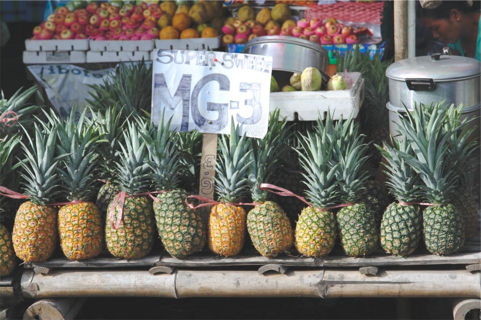 pineapples market Healthy fruits fresh food 