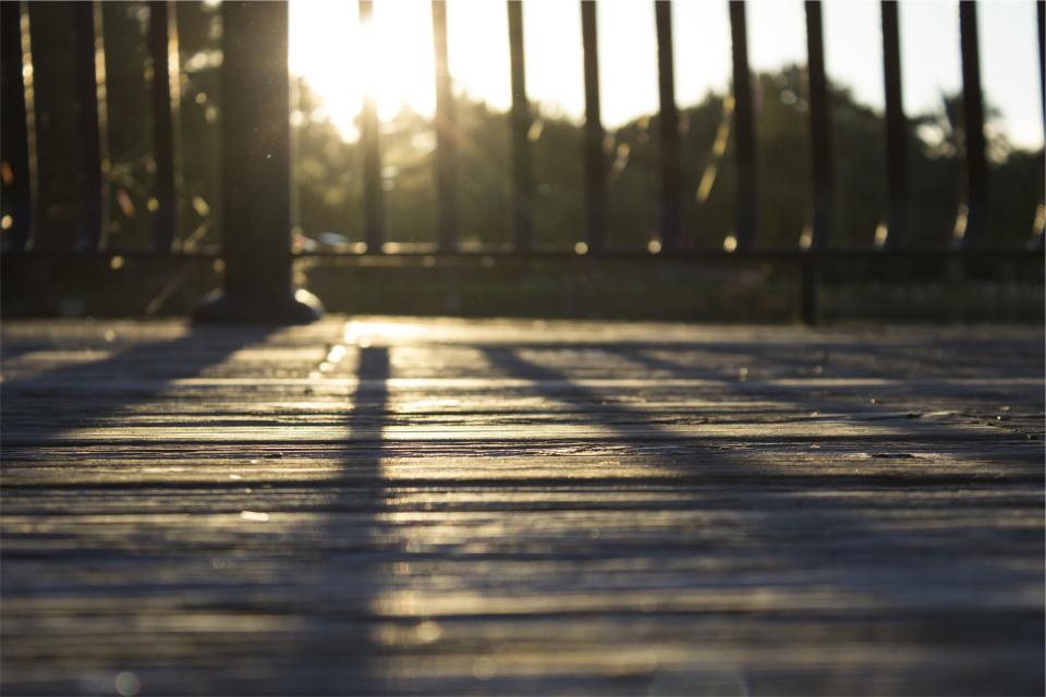 yard wood sunset shadows railing deck 