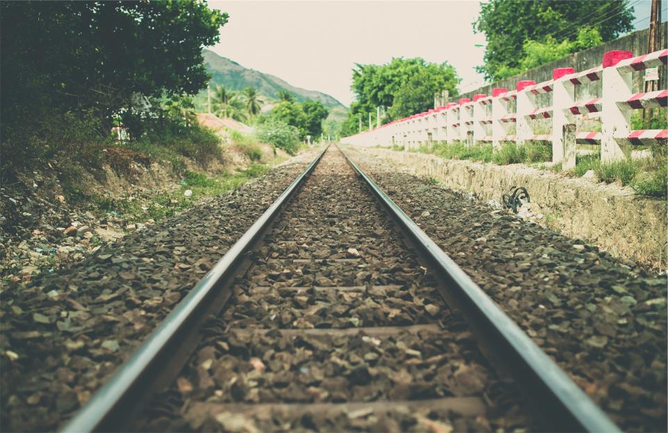 train tracks, railroad, railway, transportation, rocks, fence
