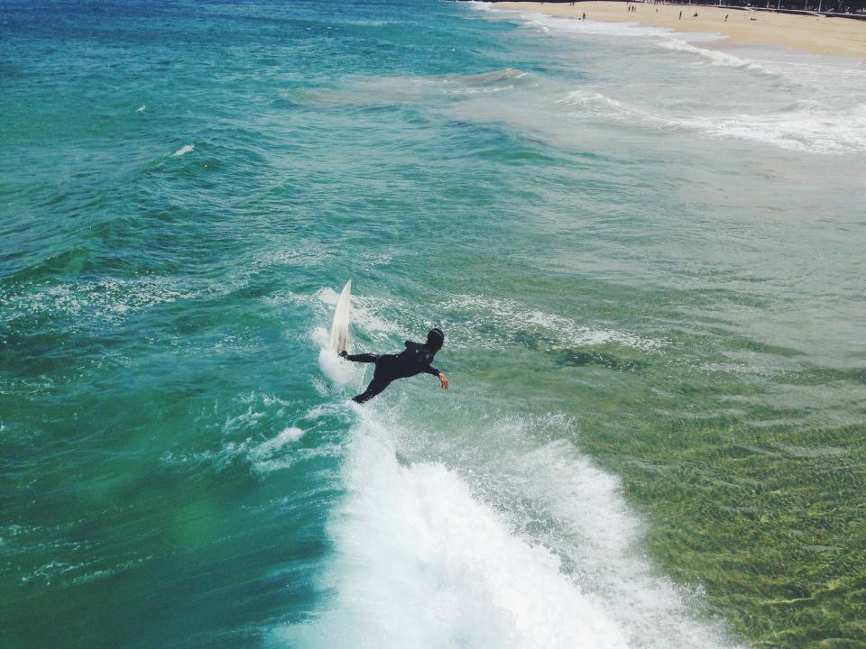 wetsuit waves water surfing surfer surfboard sports splash sea sand people ocean guy fitness beach 