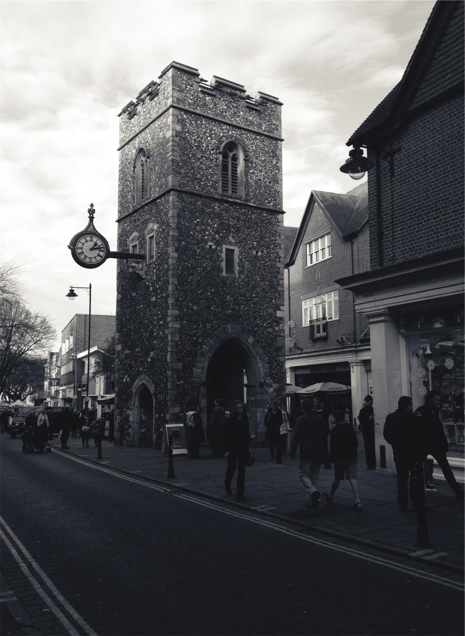 clock, tower, town, village, architecture, buildings, stores, shops, people, pedestrians, walking, streets, sidewalk, cobblestone, road, black and white