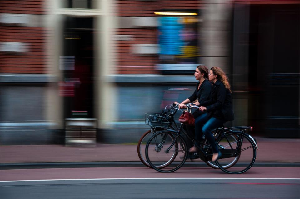 cyclists, bikers, bicycles, girls, women, woman, people, street, transportation