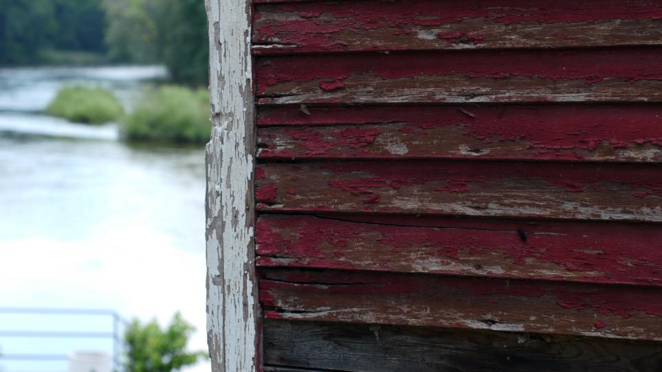 wood siding red paint chipped 