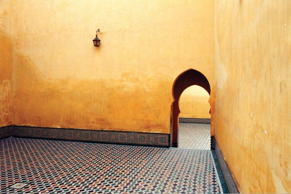 yellow walls tiles room lantern doorway 