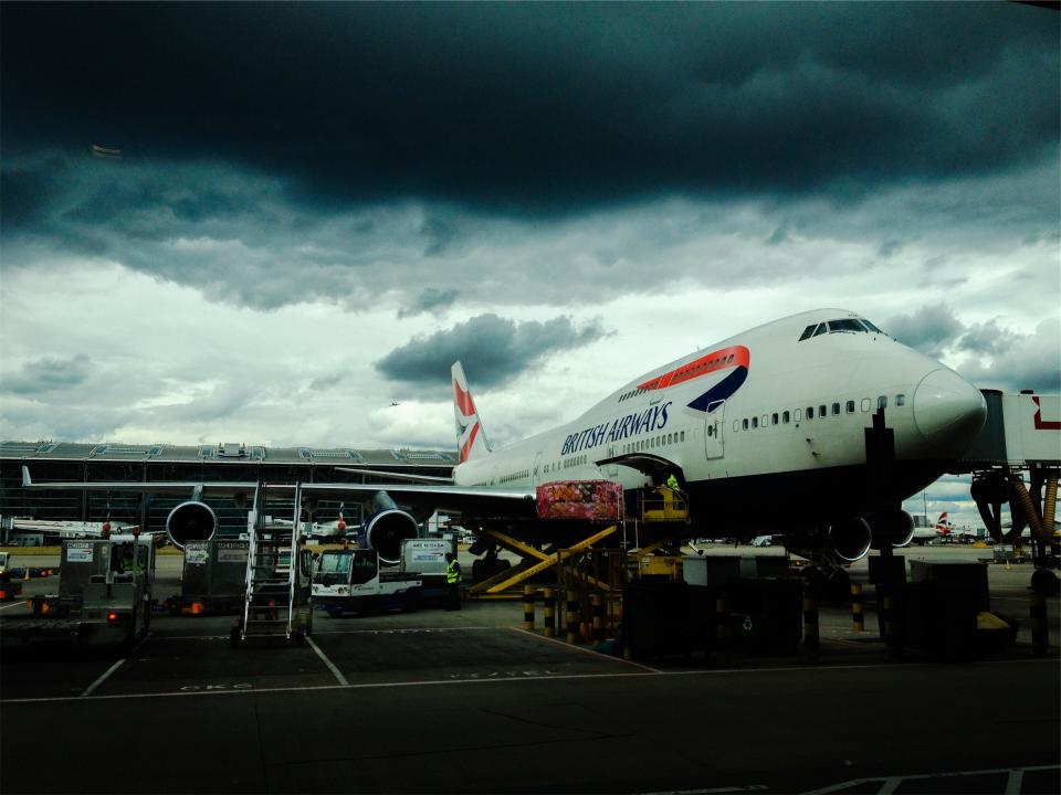 travel transportation storm luggage dark cloudy clouds BritishAirways boarding baggage airport airplane 
