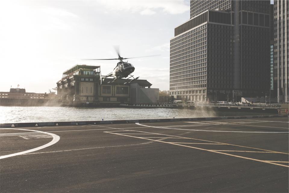 transportation pavement helipad helicopter buildings  
