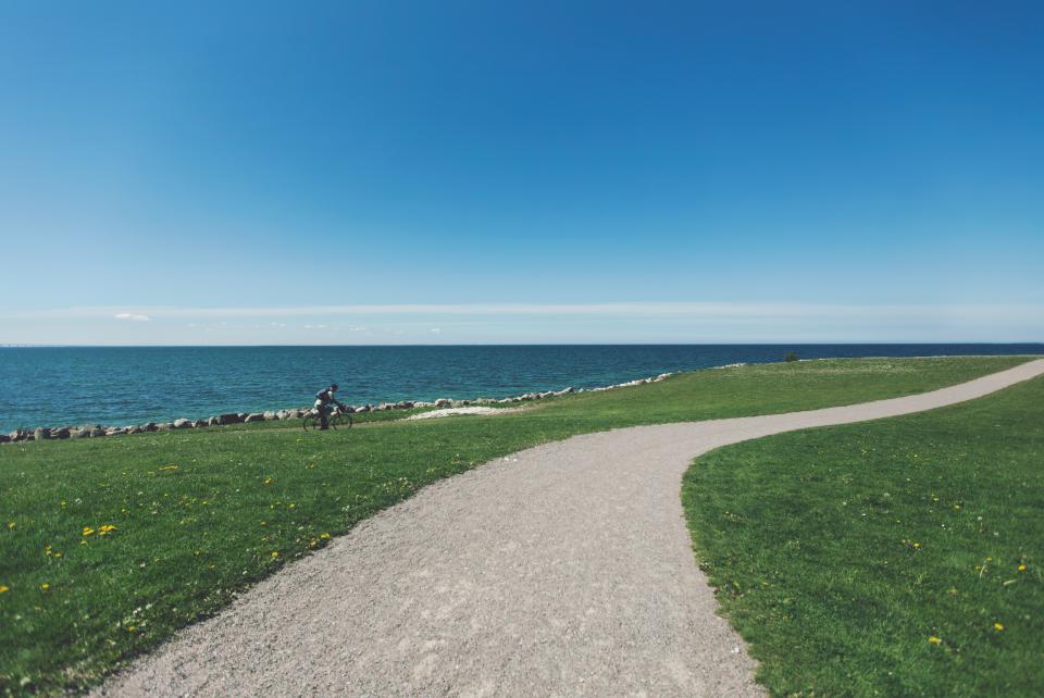 water Trail sea path ocean gravel grass cyclist cycling coast biker bike bicycle 
