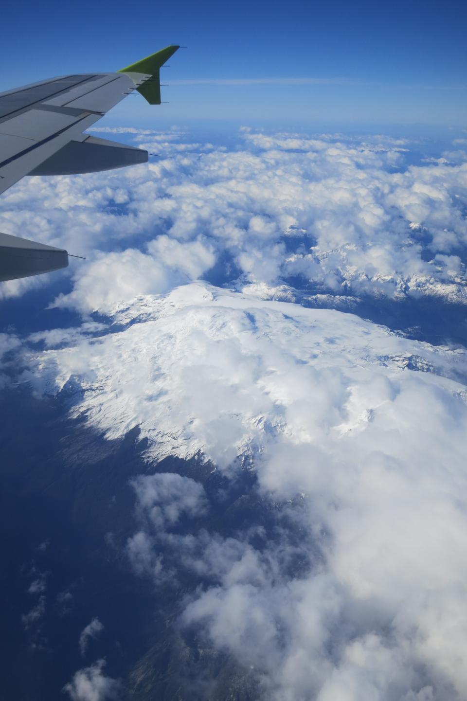wing travel transportation snow sky peaks flying flight Chile Andesmountains airplane abovetheclouds 