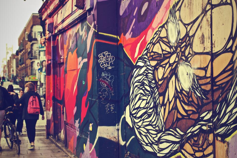 wall urban spraypaint sidewalk people pedestrians mural graffiti city art 