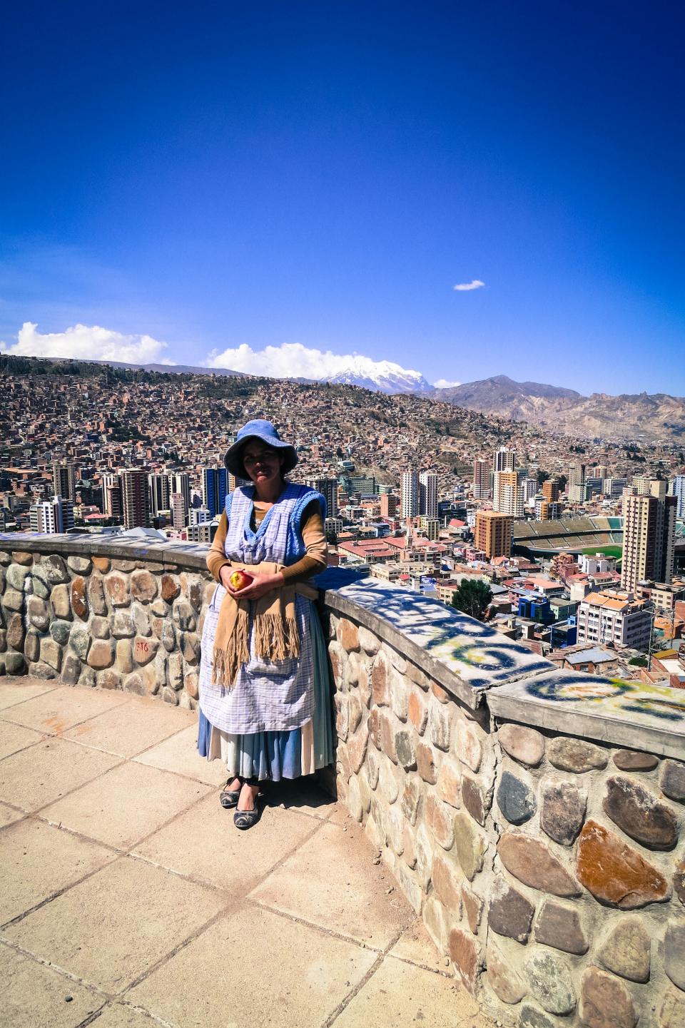 woman view mountains LaPaz lady city buildings Bolivia 