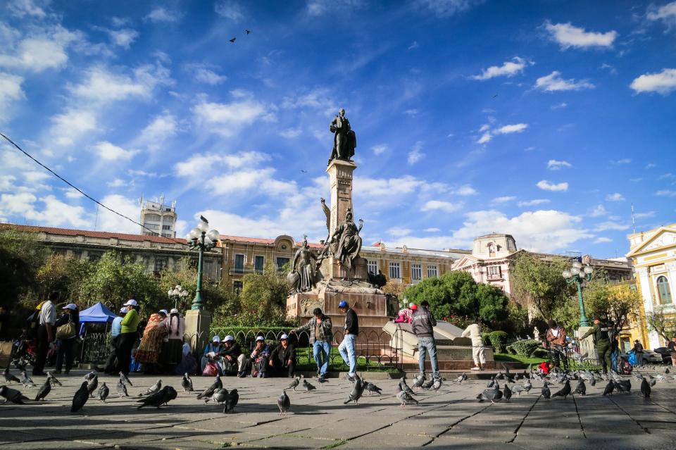 La Paz, Bolivia, landmark, monument, statue, people, pedestrians, pigeons, birds, buildings, architecture, city, urban