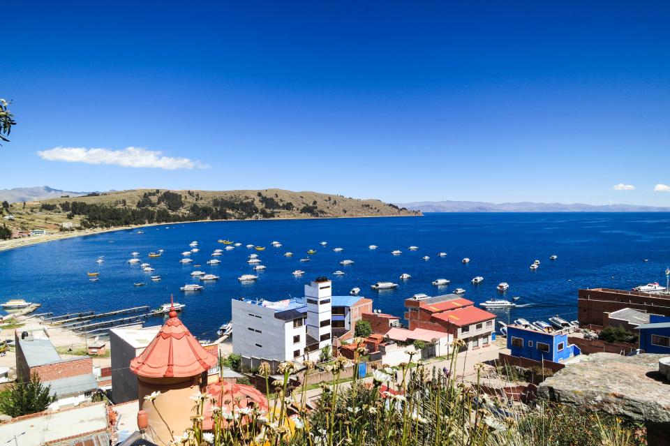 Lake Titicaca, Copacabana, Bolivia, water, boats, buildings, mountains, coast, sky, town