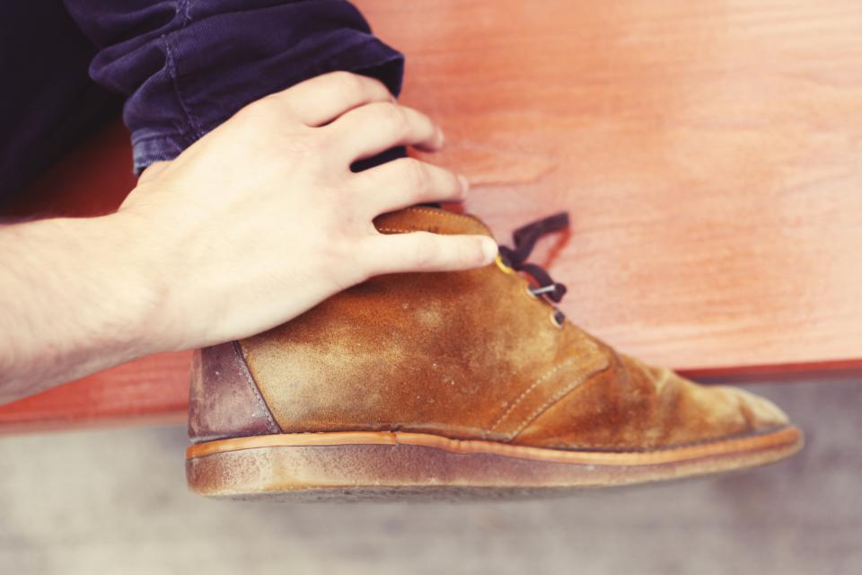 wood suede shoes pants laces jeans hands foot bench 