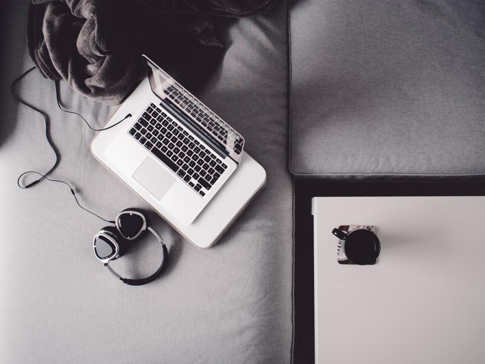 table mug modern MacBook laptop headphones deck cup couch coffee blackandwhite 