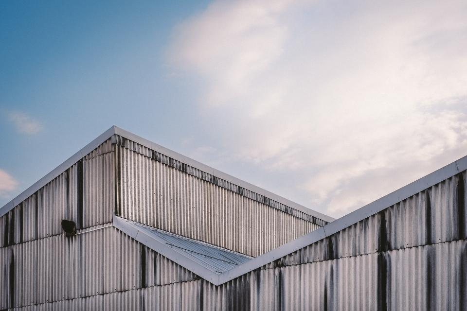 structure sky siding roof paneling clouds building architecture 