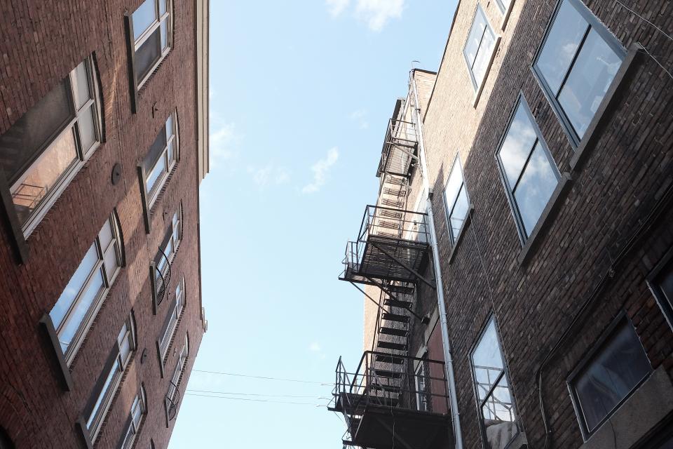 Windows walls steps stairs sky ladders houses fireescape buildings bricks apartments 