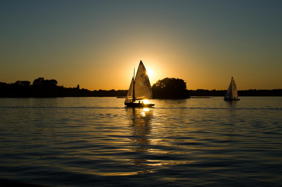 water sunset sky sea sailboats dawn 