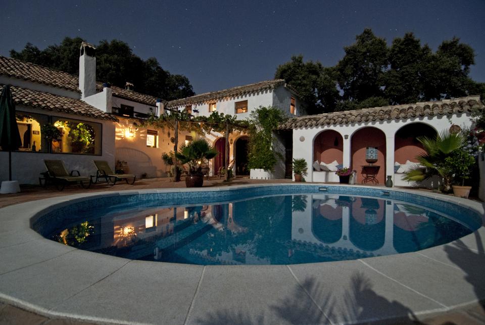 villa stars shingles roof rich pool night house chairs backyard arches 