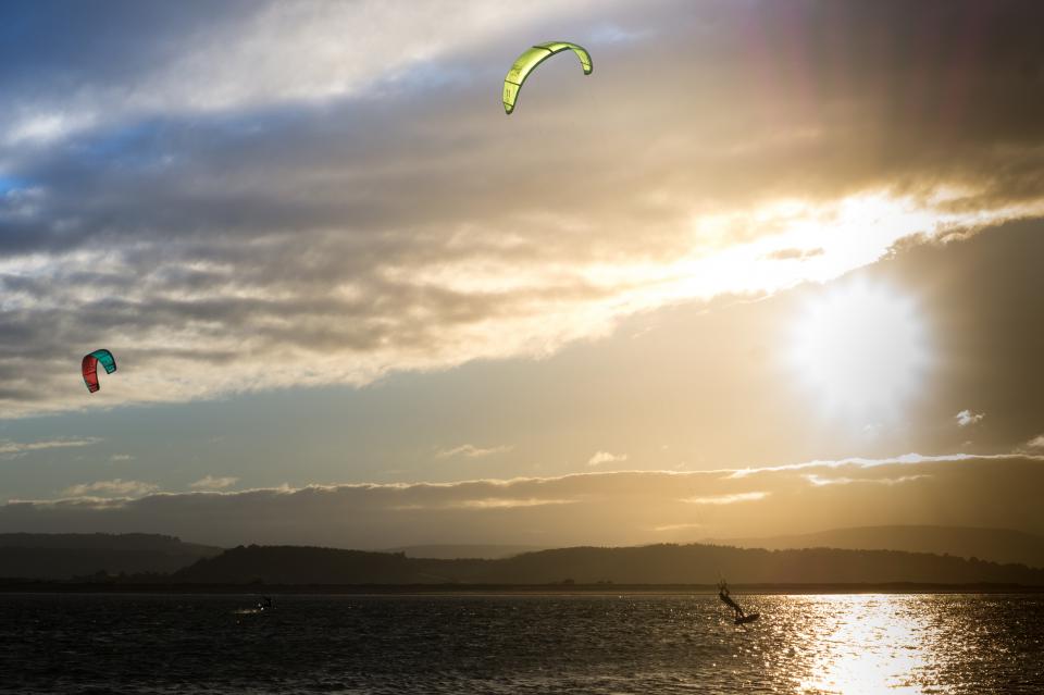 water sunset sports sky lake kitesurfing kiteboarding clouds 