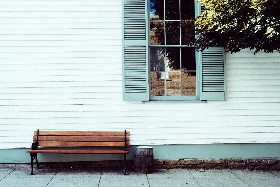wood window siding sidewalk shutters bench  