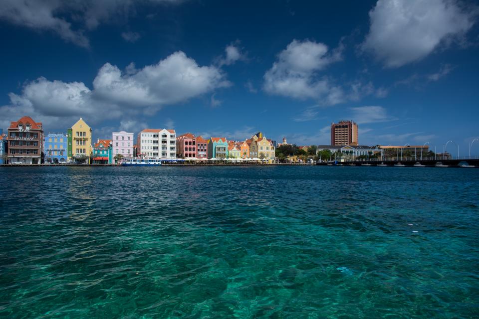 Willemstad skyline sky sea pier island dock Curaçao colors clouds Caribbean buildings boats boardwalk architecture 