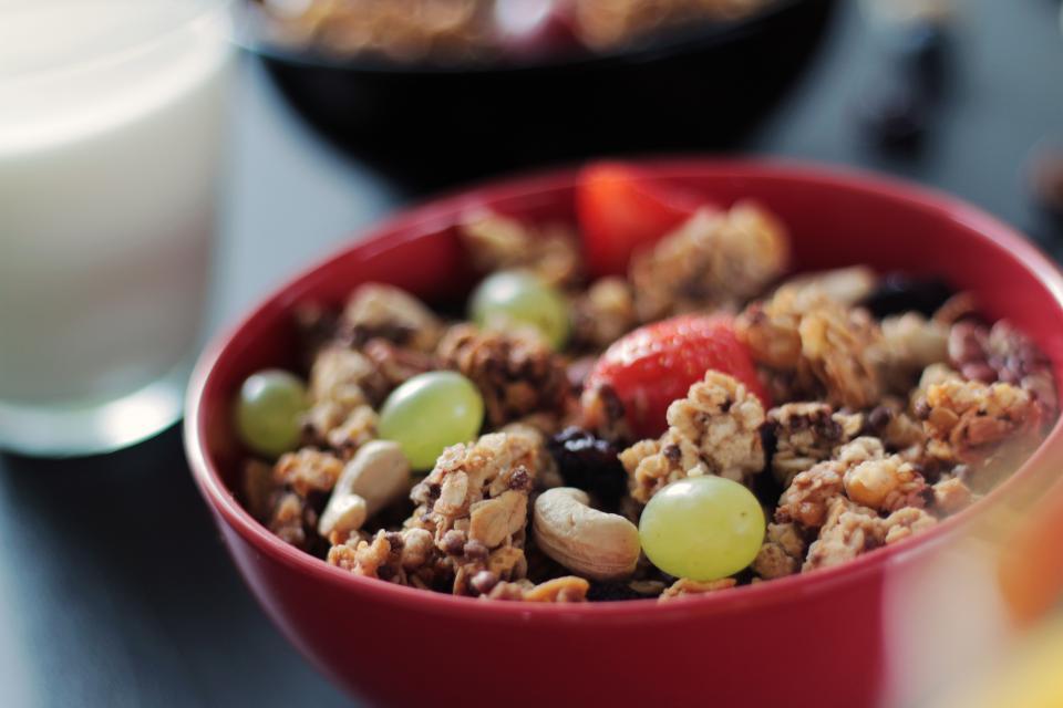 strawberries nuts muesli morning milk Healthy grapes fruits cereal cashews breakfast bowl 