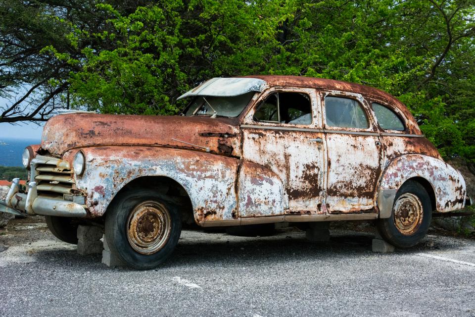 vintage rust pavement old cinderblocks car automobile 