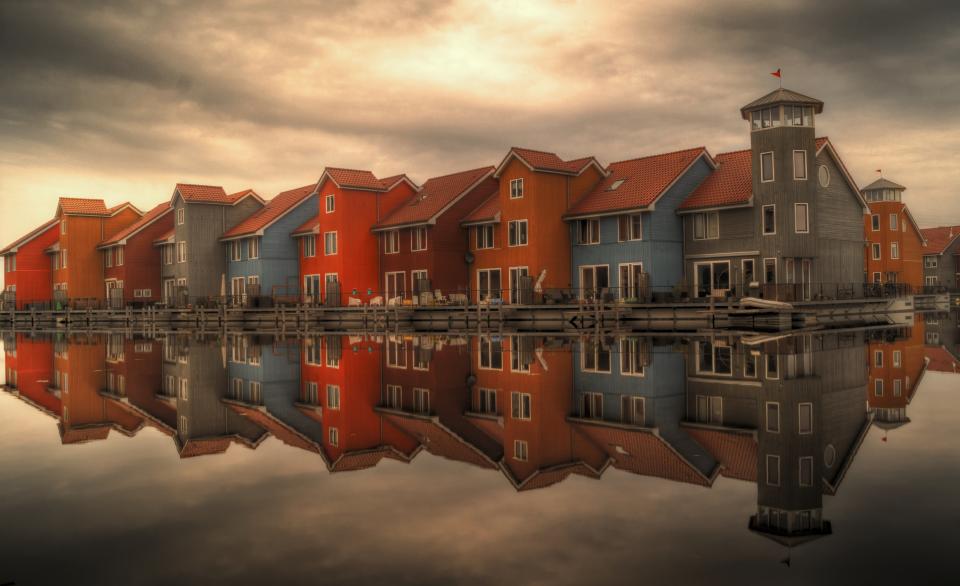 water sky roofs reflection Netherlands houses docks colorful architecture 