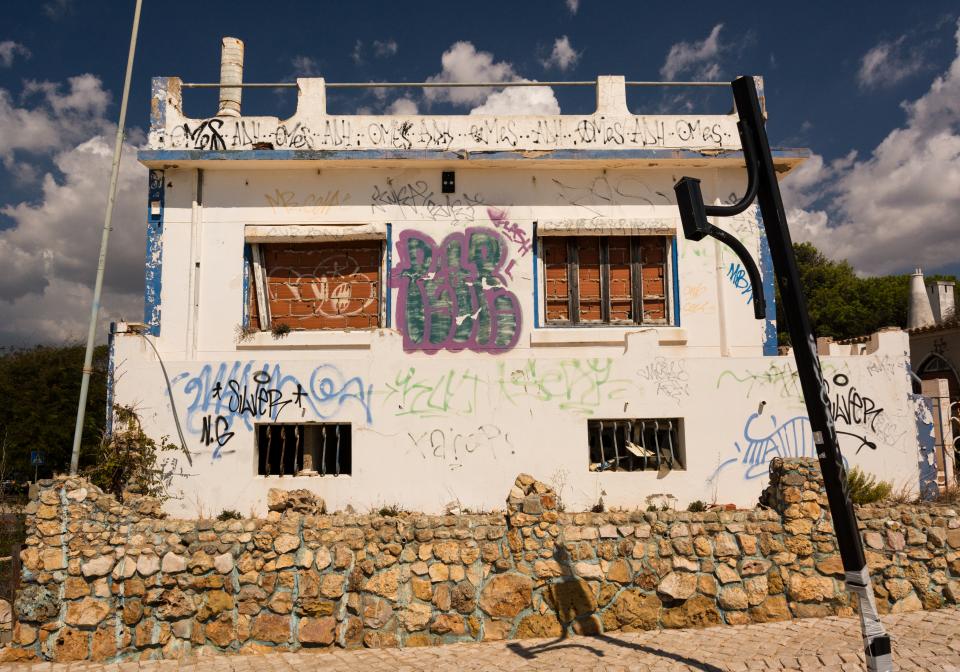 stones spraypaint graffiti building abandoned 