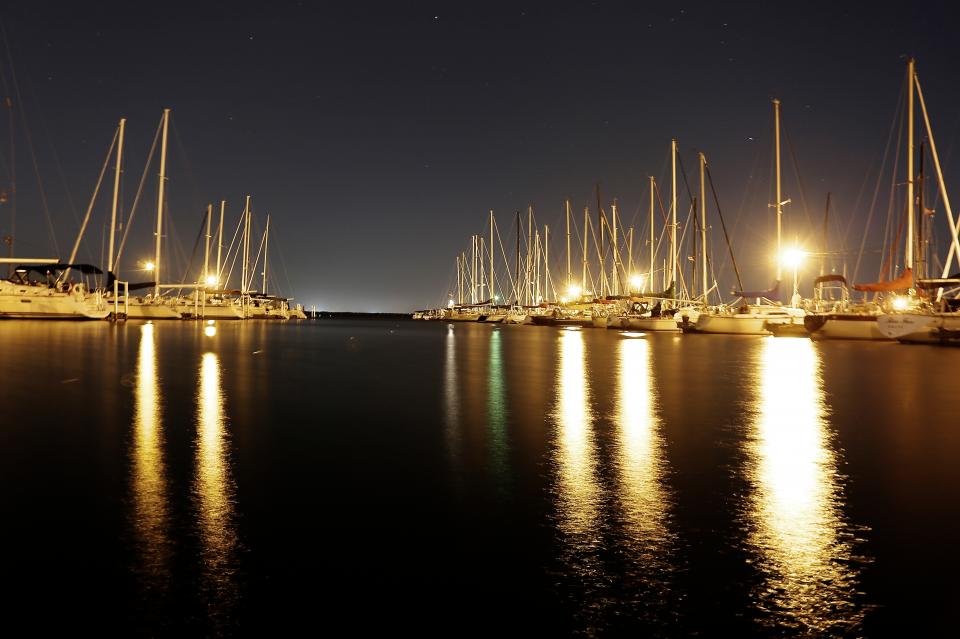 water sailboats port pier night lights docks dark 