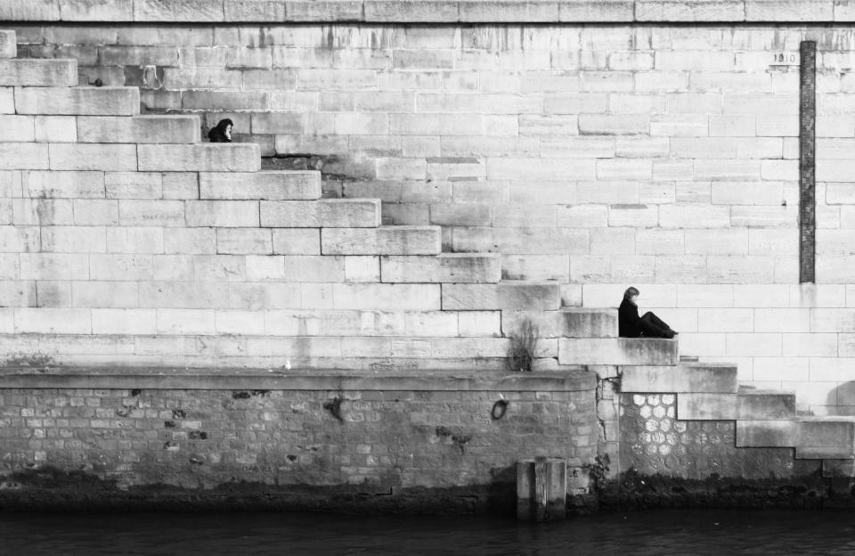 woman water wall stairs sitting brick blackandwhite 