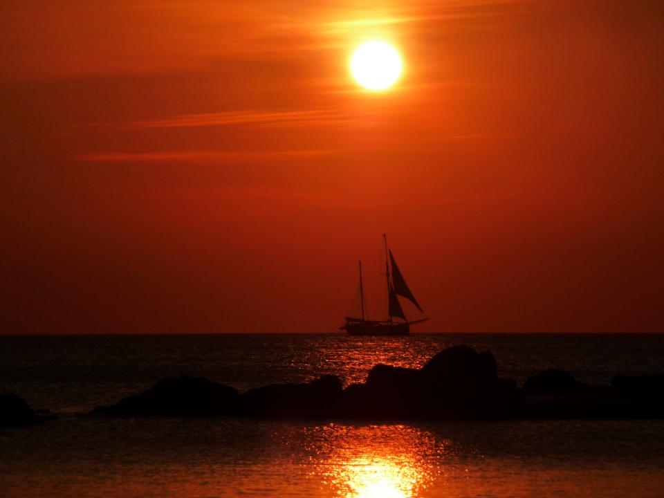 water sunset sky sea sailboat red ocean 