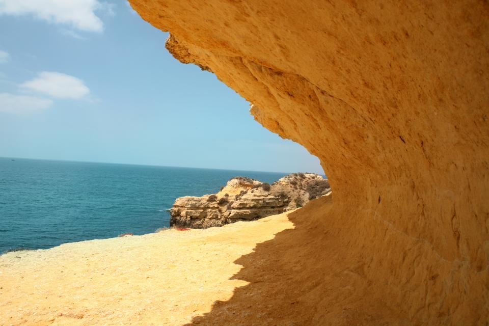 water sunshine shore sea sand rocks cliffs beach 
