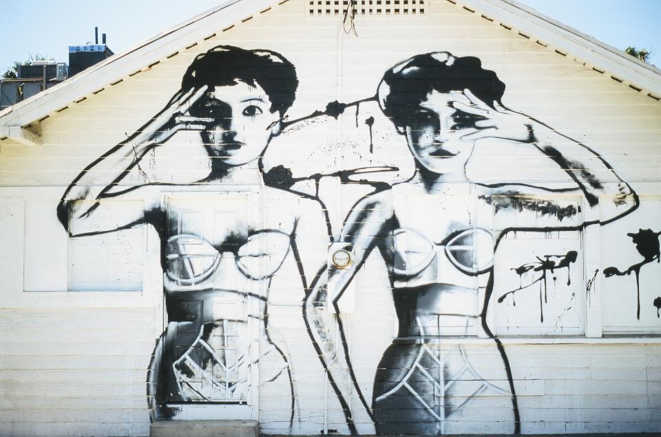 women wall siding painting graffiti girls bathingsuit 