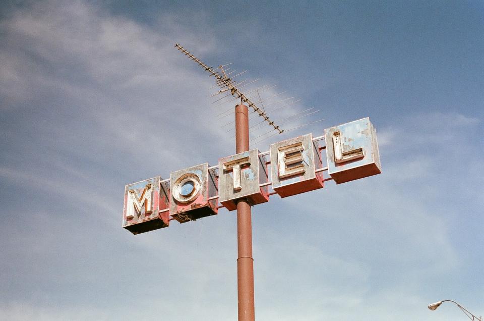 vintage sky sign rust pole motel 