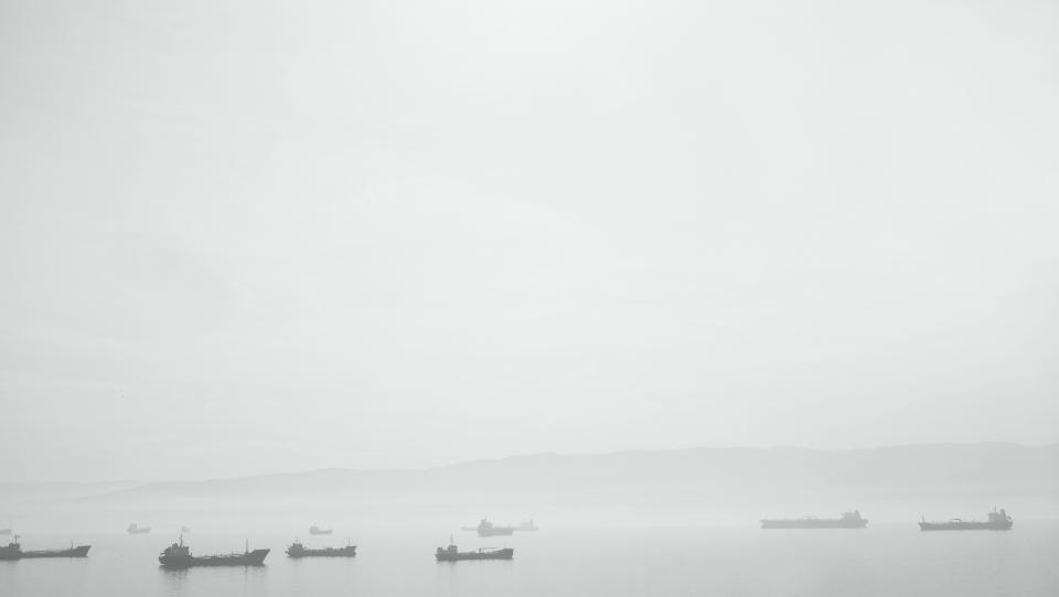 water steam sky ships ocean haze grey fog boats blackandwhite 