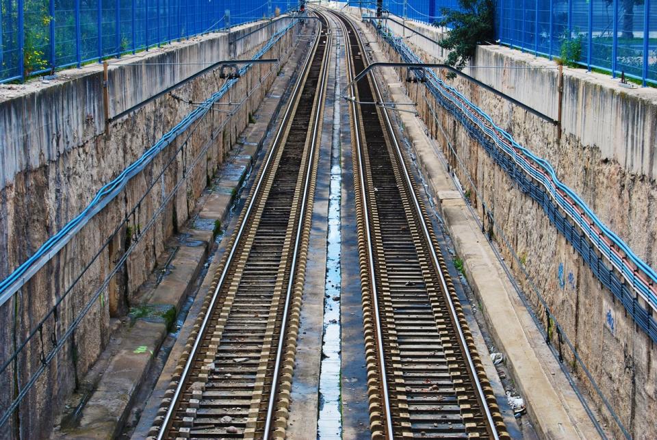 traintracks railroad fence empty concrete blue 