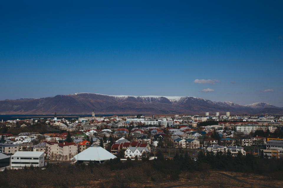 view valleys town skyline sky peaks mountains iceland city buildings 