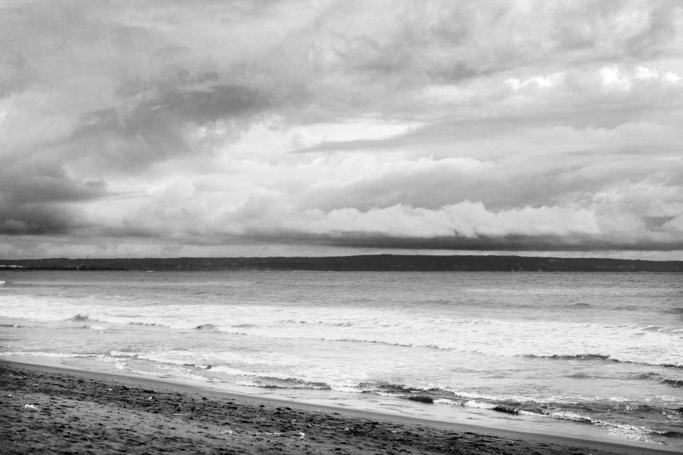 white waves water sky sea sand ocean grey clouds black beach 