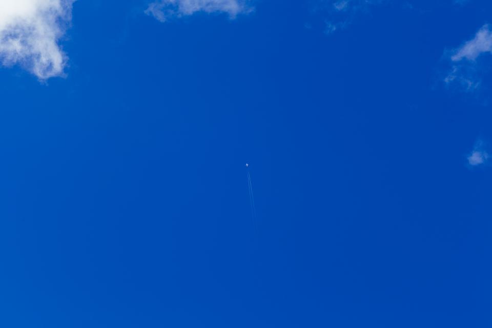 sky jet flying clouds blue airplane 