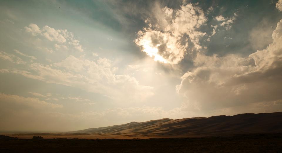sunrays sunny sunlight sky sand hills desert clouds 