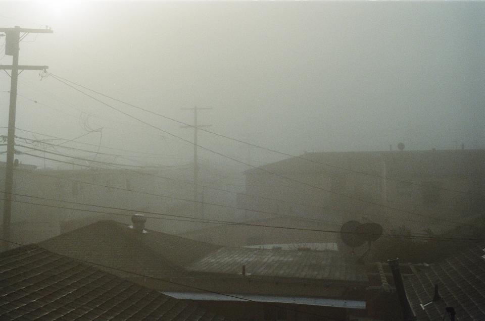 sky rooftops houses fog buildings 