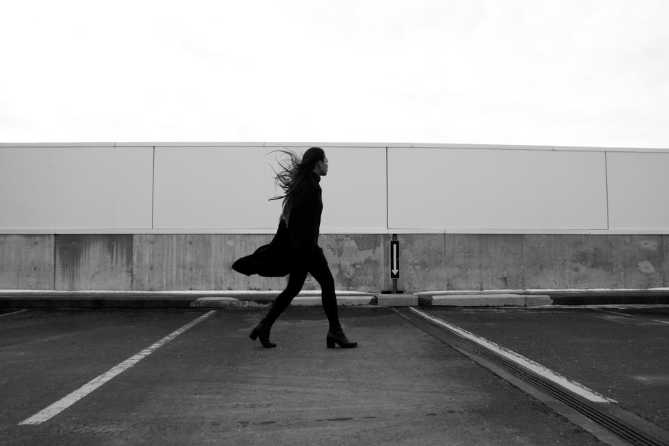 woman windy people pavement parkinglot model heels girl fashion Coat boots blackandwhite 