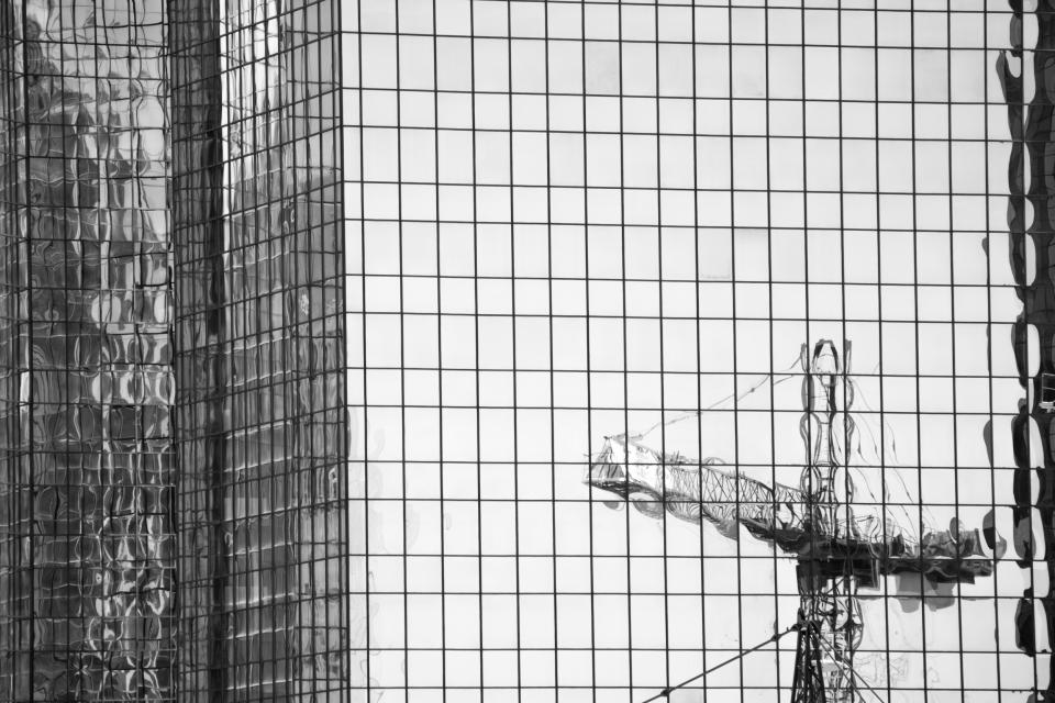 Windows urban towers reflection highrises crane construction city building architecture 
