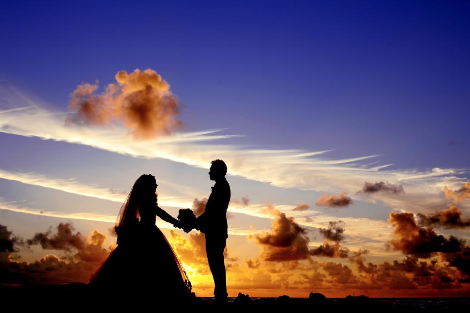 wedding tropical sunset sky silhouette sea Maldives lagoon island groom dusk couple clouds bride bridal bouquet beach atoll 