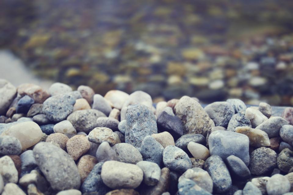 rocks pebbles clearwater blur bluefilter beach 