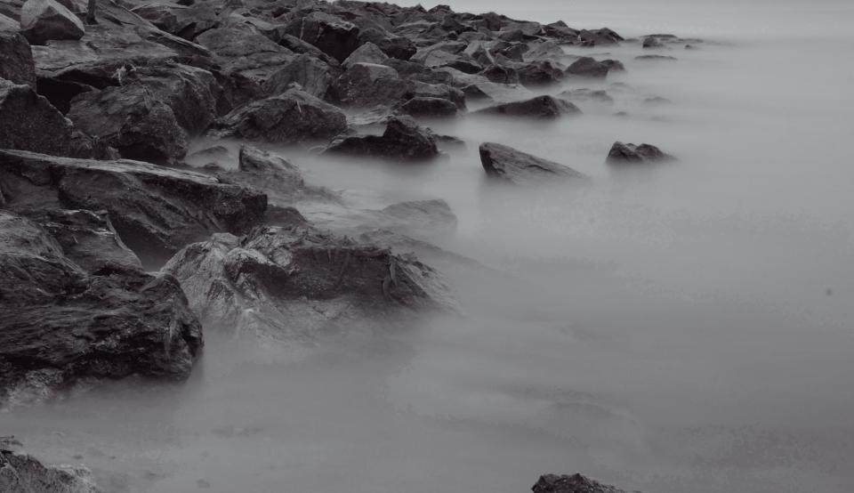 rocks mist grey coast boulders 