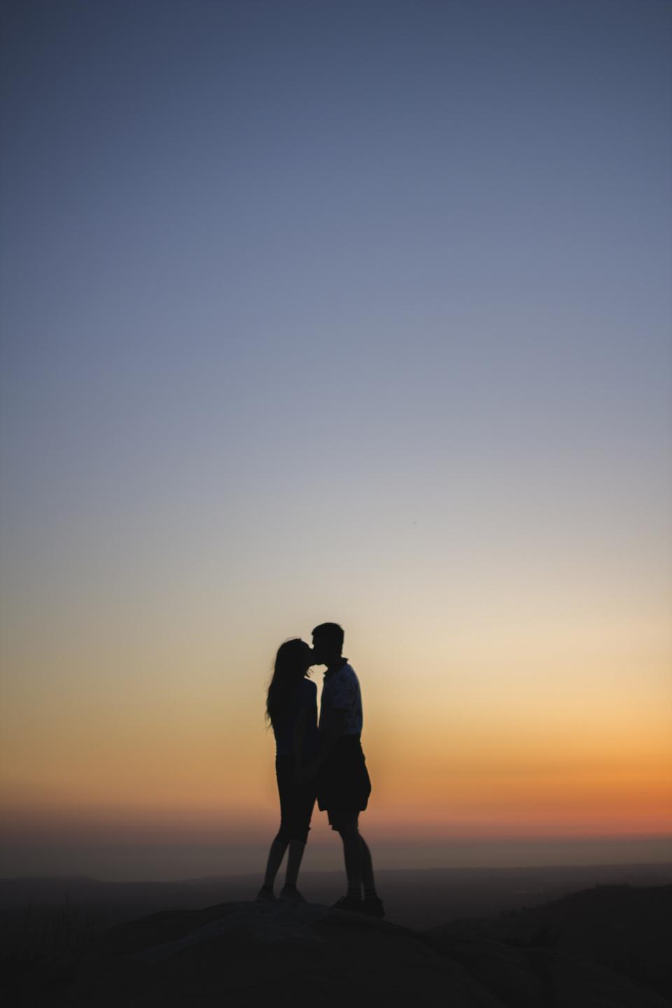 sunset silhouette romance night love kissing holdinghands dusk couple 