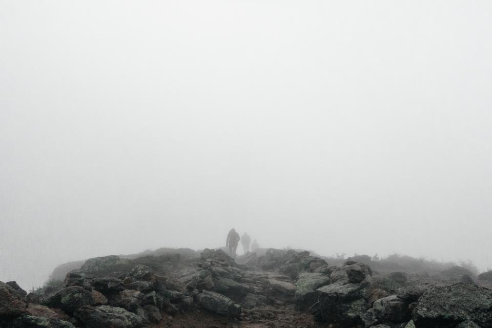trekking Trail rocks outdoors hiking hikers grey fog cloudy backpacking 