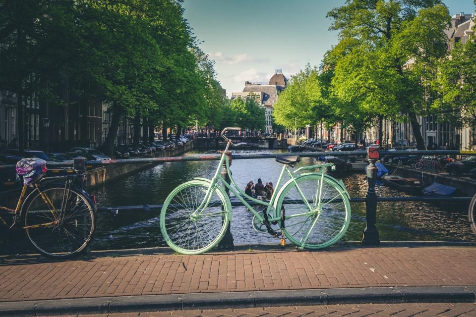 town cobblestone city canal Bridge bikes bicycles 
